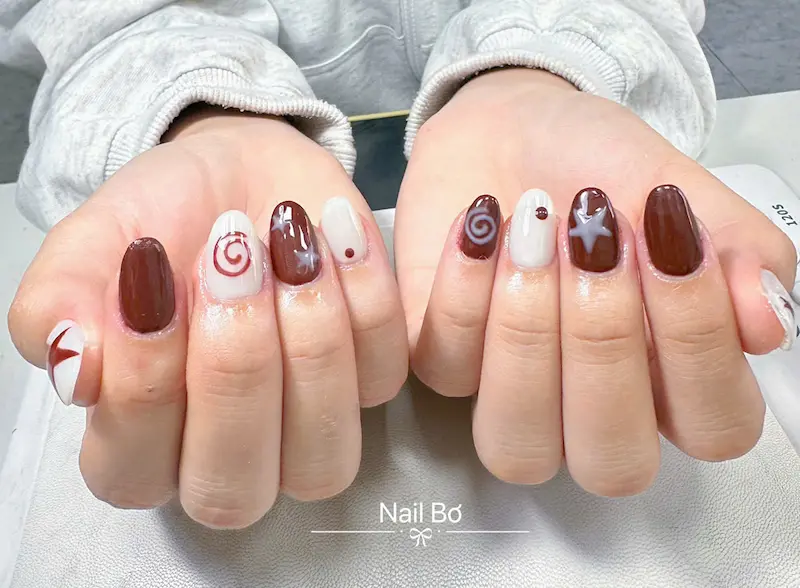 Mẫu úp móng thiết kế đính charm nơ phong cách tiểu thư tinh tế